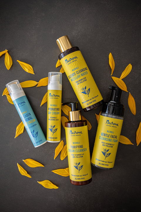Nurme skincare products in yellow and blue packaging, including Cleansing Foam, Cream Cleanser, Micellar Water, Night Cream, and Day Cream. Designed for all skin types with vitamins A-C, hyaluronic acid, and anti-pollution properties.